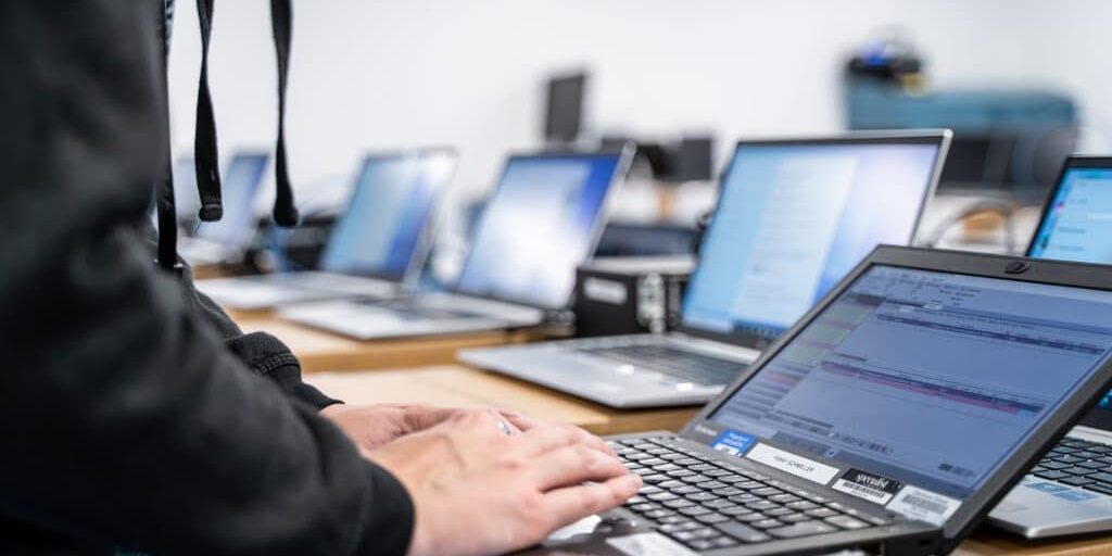 Sectors - laptops on desks, technology